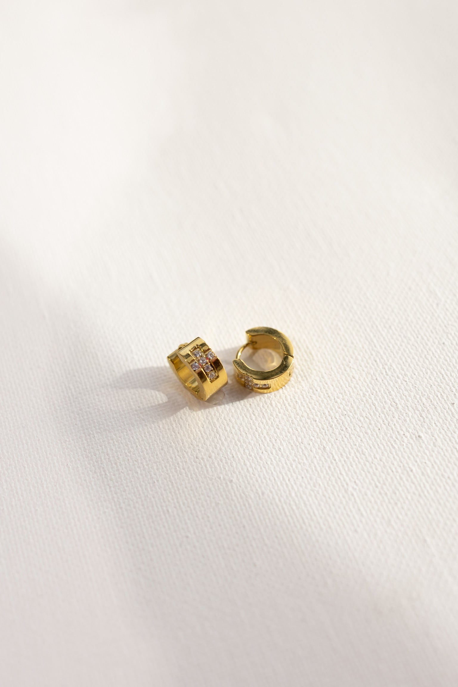 Ezri Crystal Cross Huggie Earrings || Choose Color